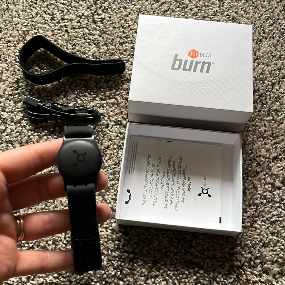 OTF heart rate monitor with both large and small straps and charger